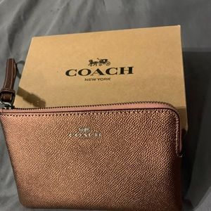 Coach Wristlet, Never used. Metallic Pink
